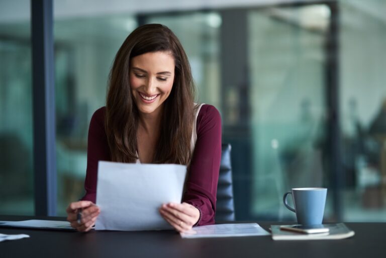 Keep working up new ideas. Shot of a young businesswoman working on her admin.